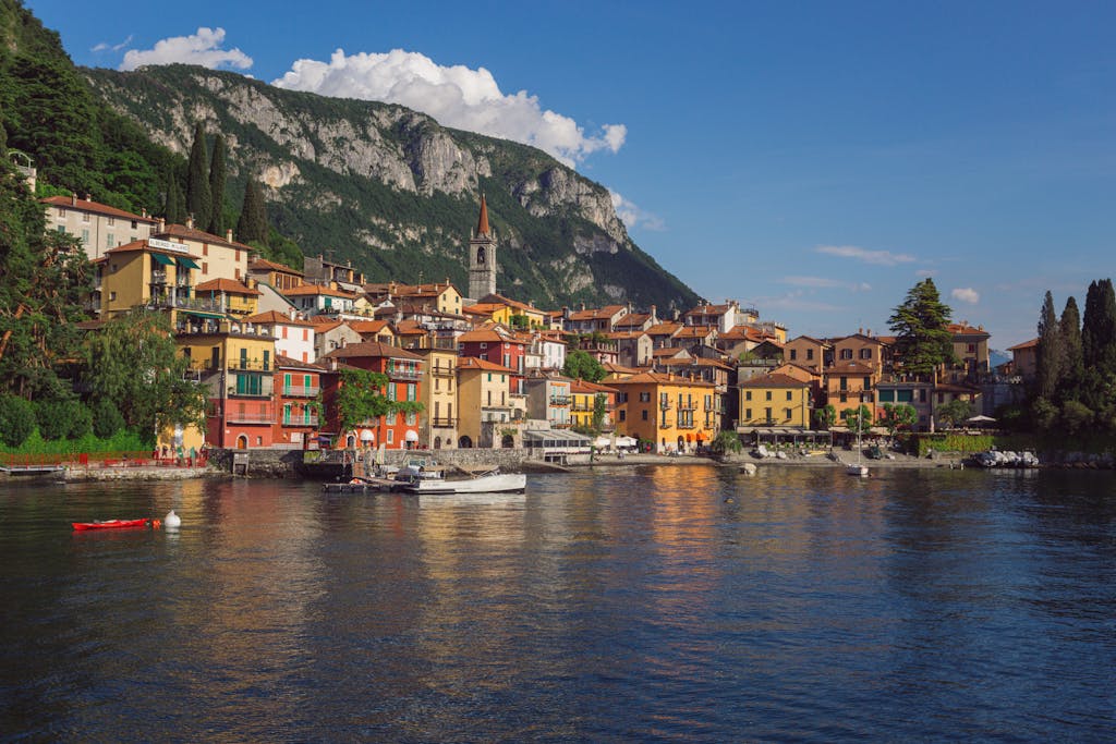 Charming view of Varenna village and Lake Como surrounded by mountains in Italy.